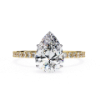 Picture of 1.25 Carat Pear Solitaire Ring Adorned with Smaller Diamonds.( 1.55 CTW Diamonds)